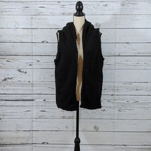 Black hooded vest .